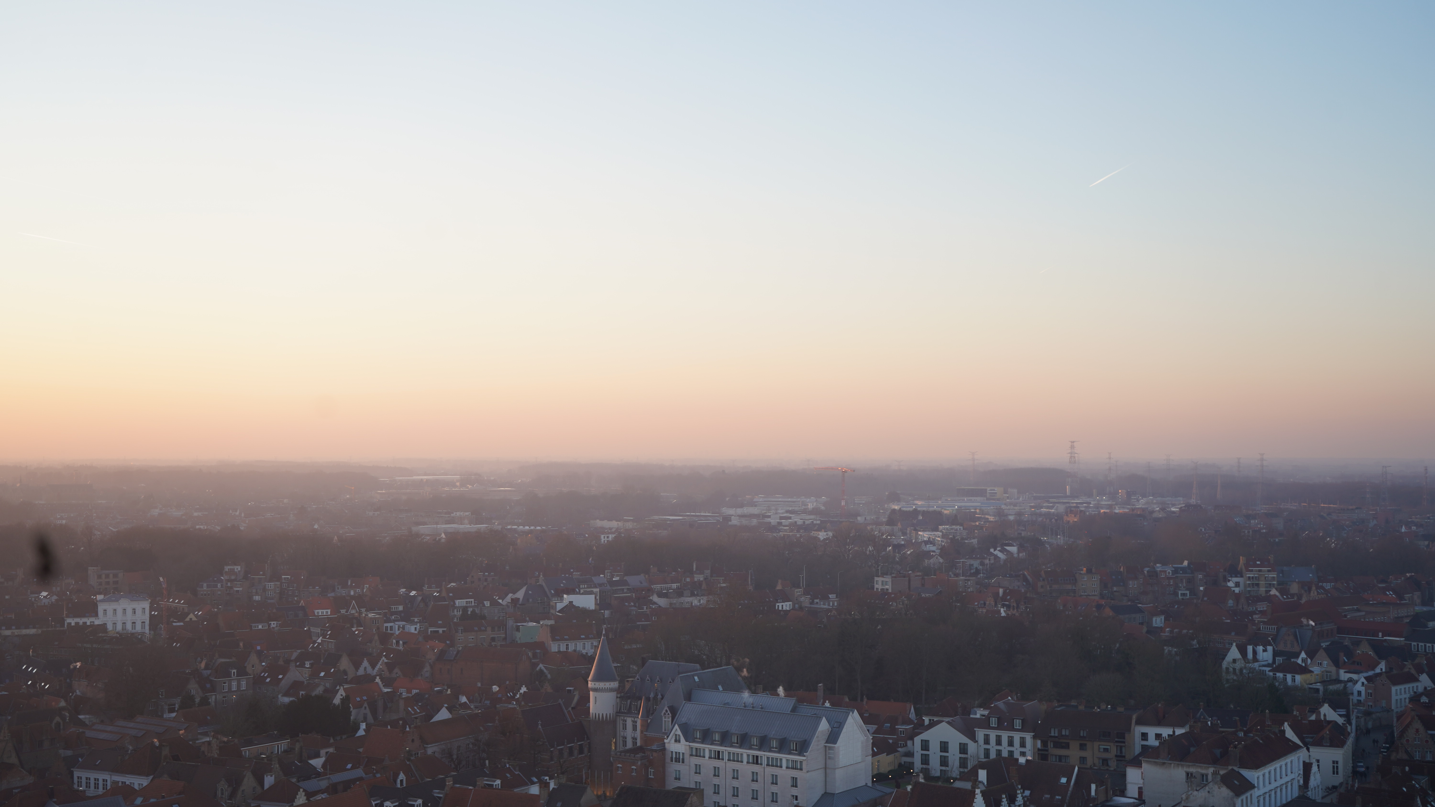  a city with buildings and a sunset
